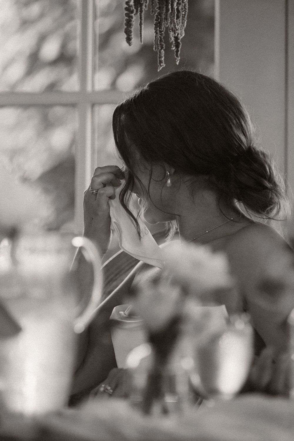 Black and white candid moments captured during wedding reception speeches.