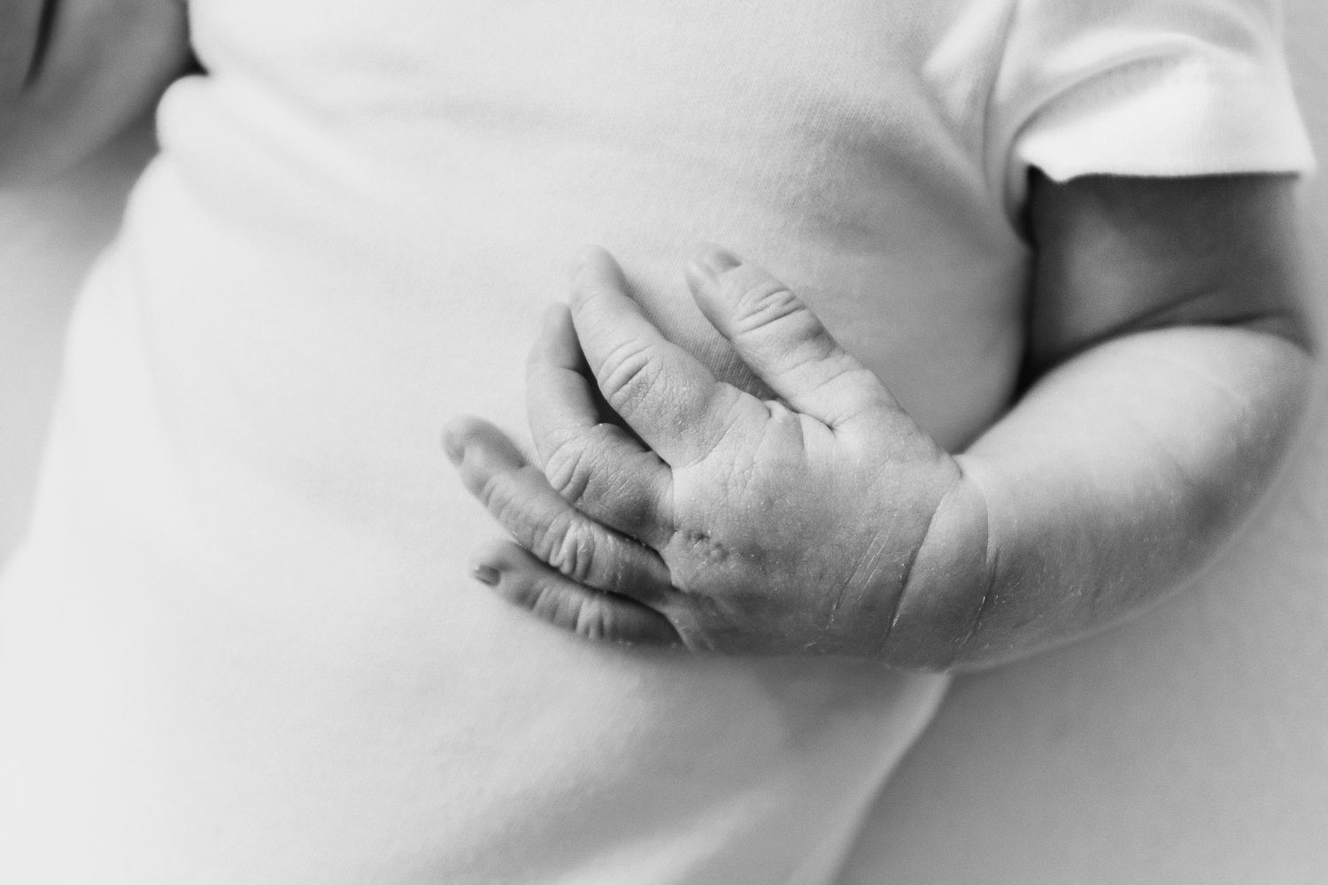 Newborn photography Nottingham baby close up of tiny hand while sleeping detail shot