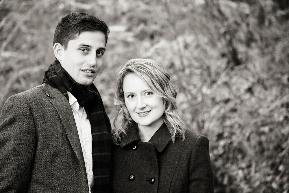 Black and white engagement portraits showing intimate moments between couple.