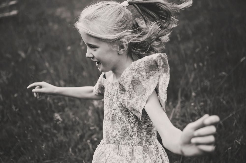 Black and white photo collage showing intimate wedding moments with dancing, smiles and love by a window.