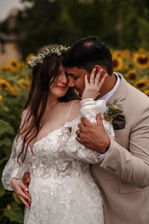A romantic wedding photoshoot sequence in front of sunflowers shows tender moments between a couple in white and beige attire.
