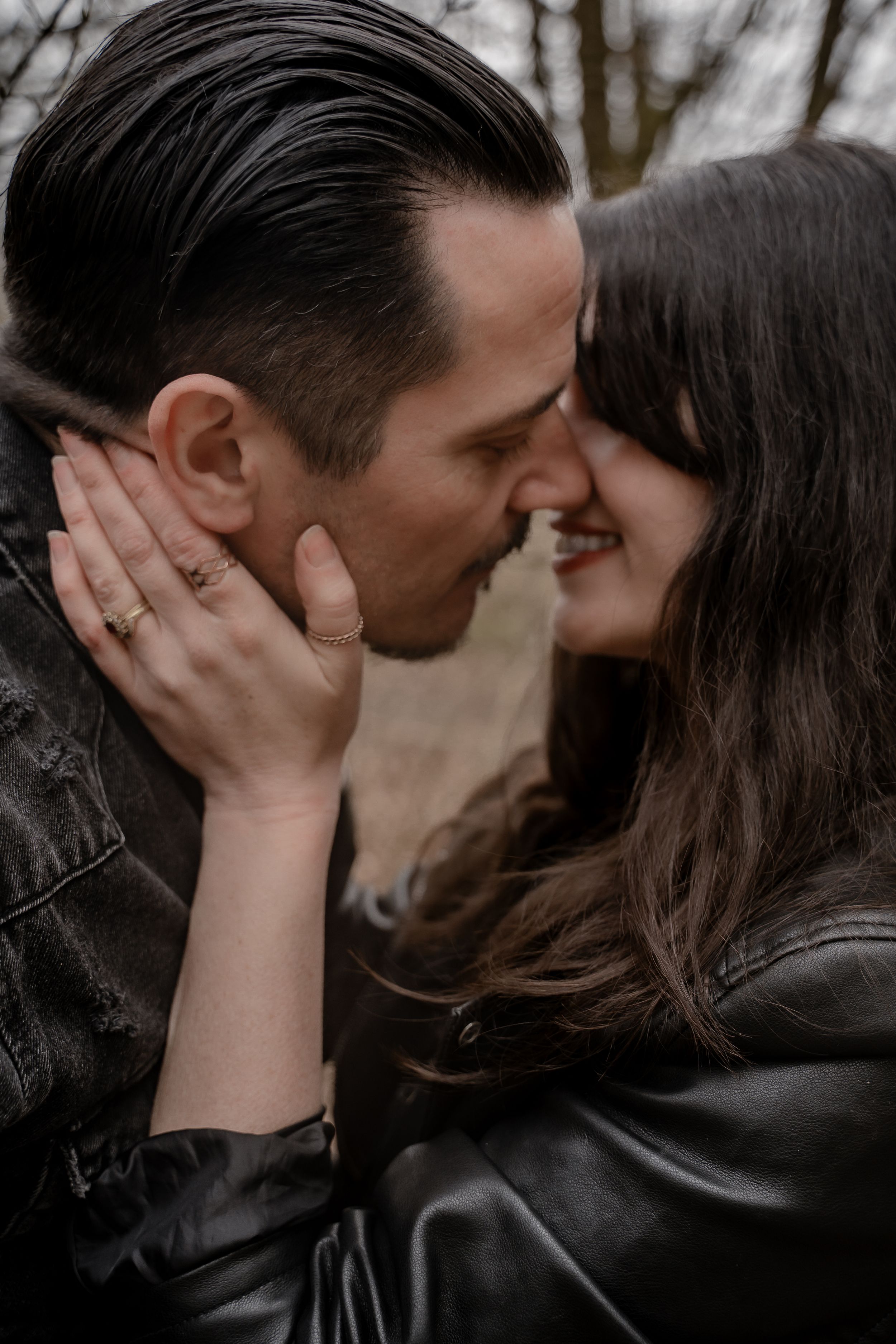 A romantic couple sharing an intimate kiss in a series of black and white photographs.
