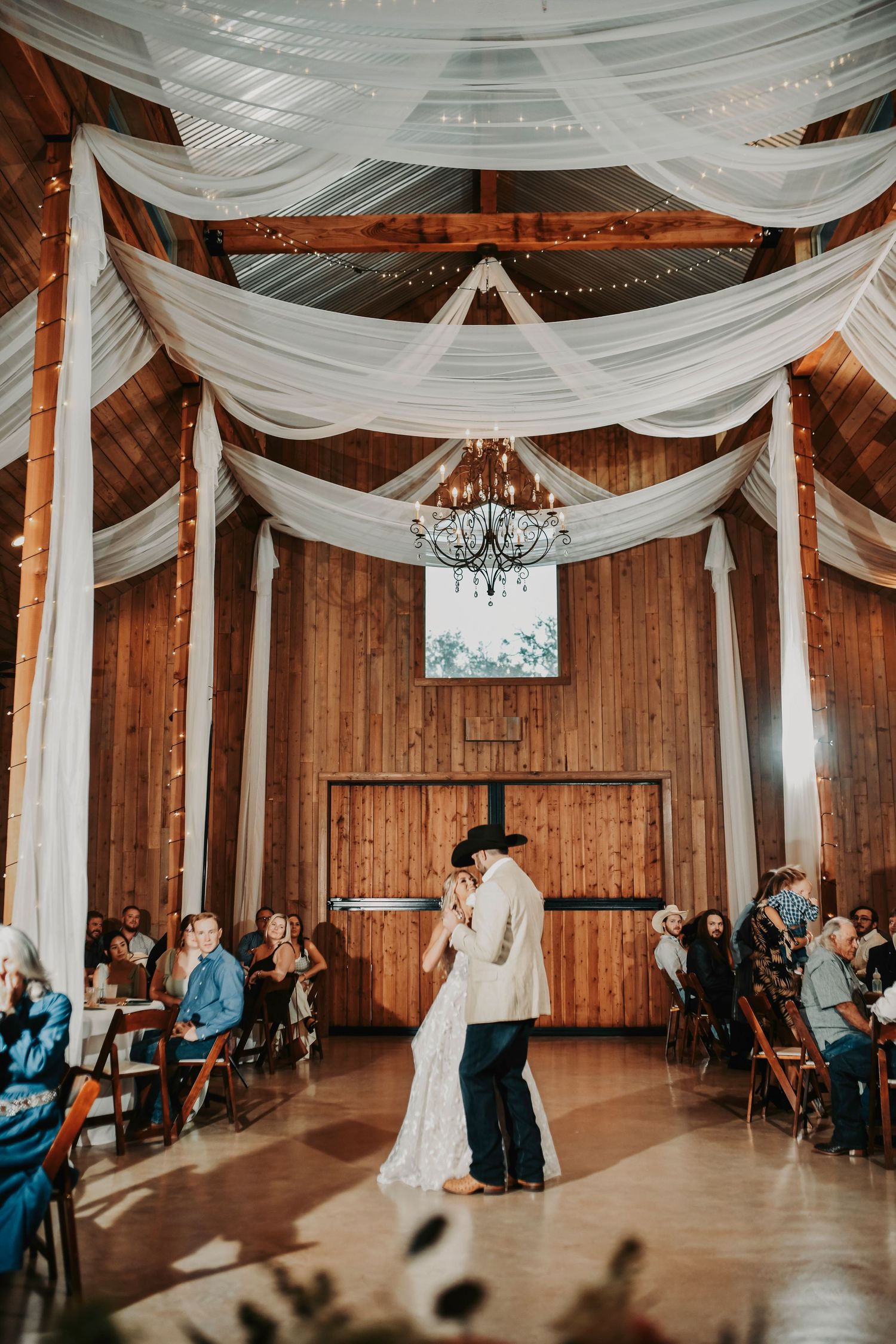 Guests dancing wildly at Whispering Oaks barn reception