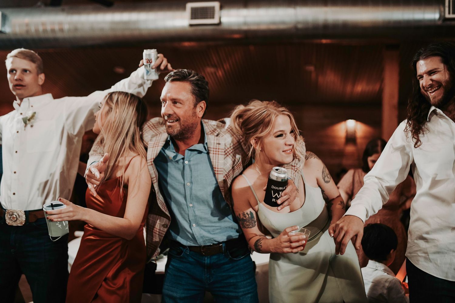 Candid reception dance shots under string lights at Whispering Oaks Wedding Venue