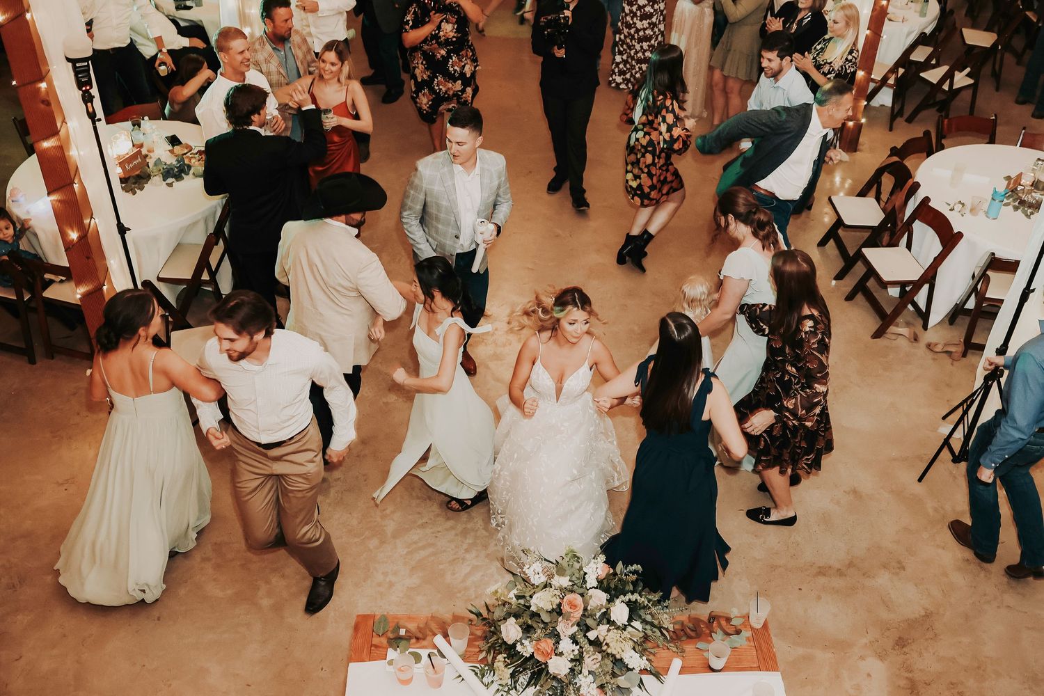 Wedding guests enjoying drinks, laughter, and music