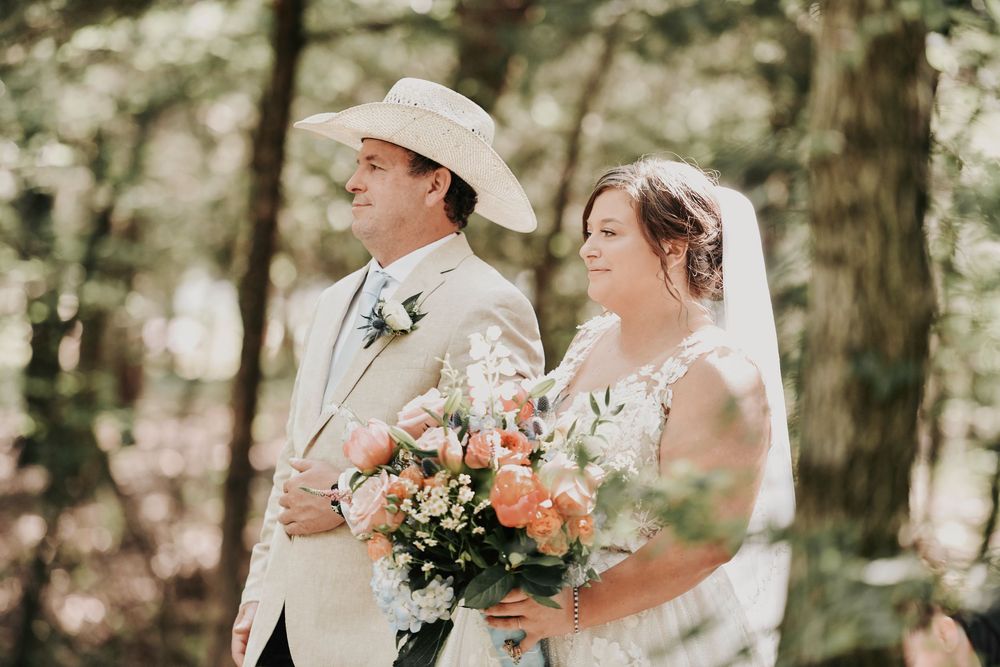 Bride walking down the aisle at Whispering Oaks wedding venue