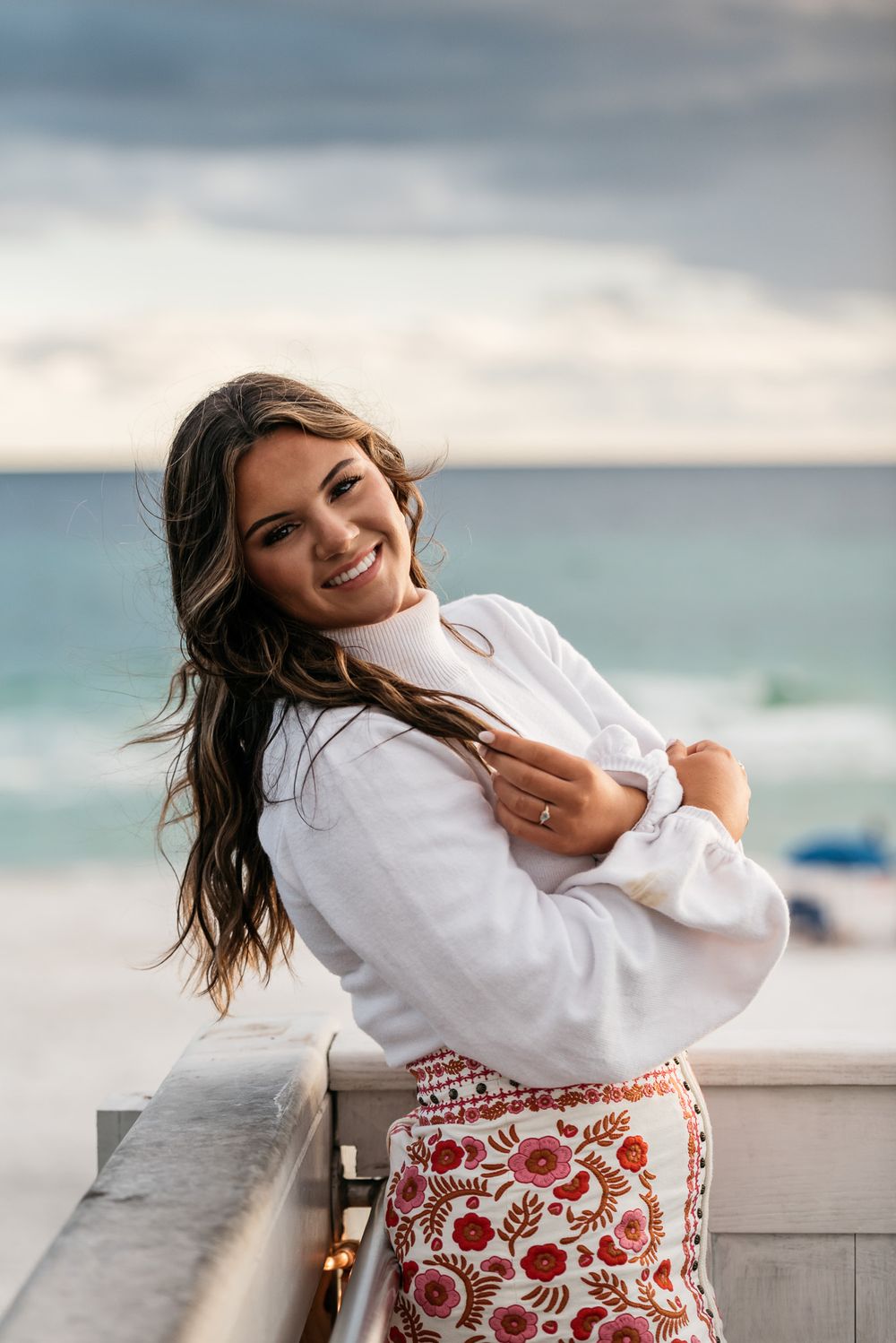 Senior portrait with a Turquoise colored ocean backdrop in the Gulf of Mexico off of 30A