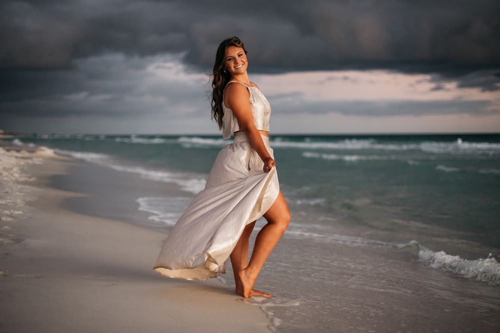 Beautiful flowing dress in the sea breeze on Santa Rosa Beach Florida during a Senior Portrait session with MJphotograph.com