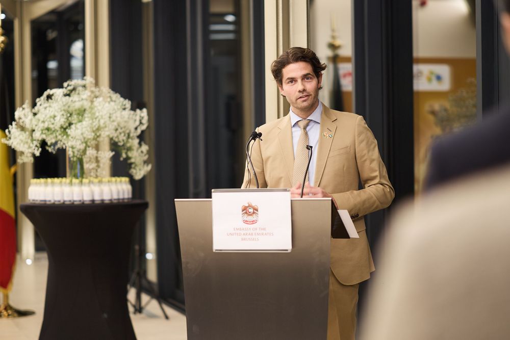 Corporate event photographer in Europe photographing executive exchange during executive meeting.