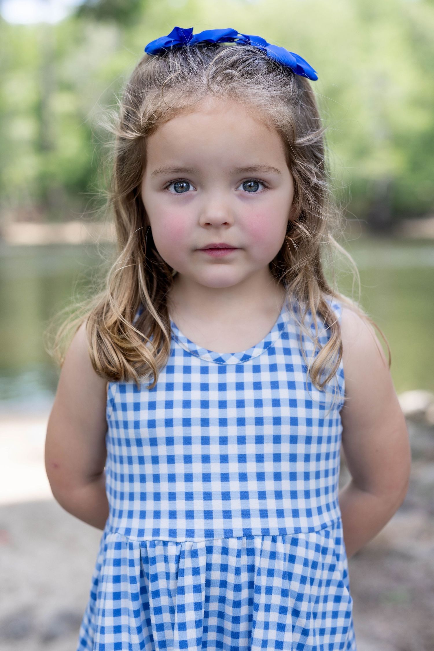 Girl portrait near water during summer sunset, taken in Amherstburg by Windsor photographer.