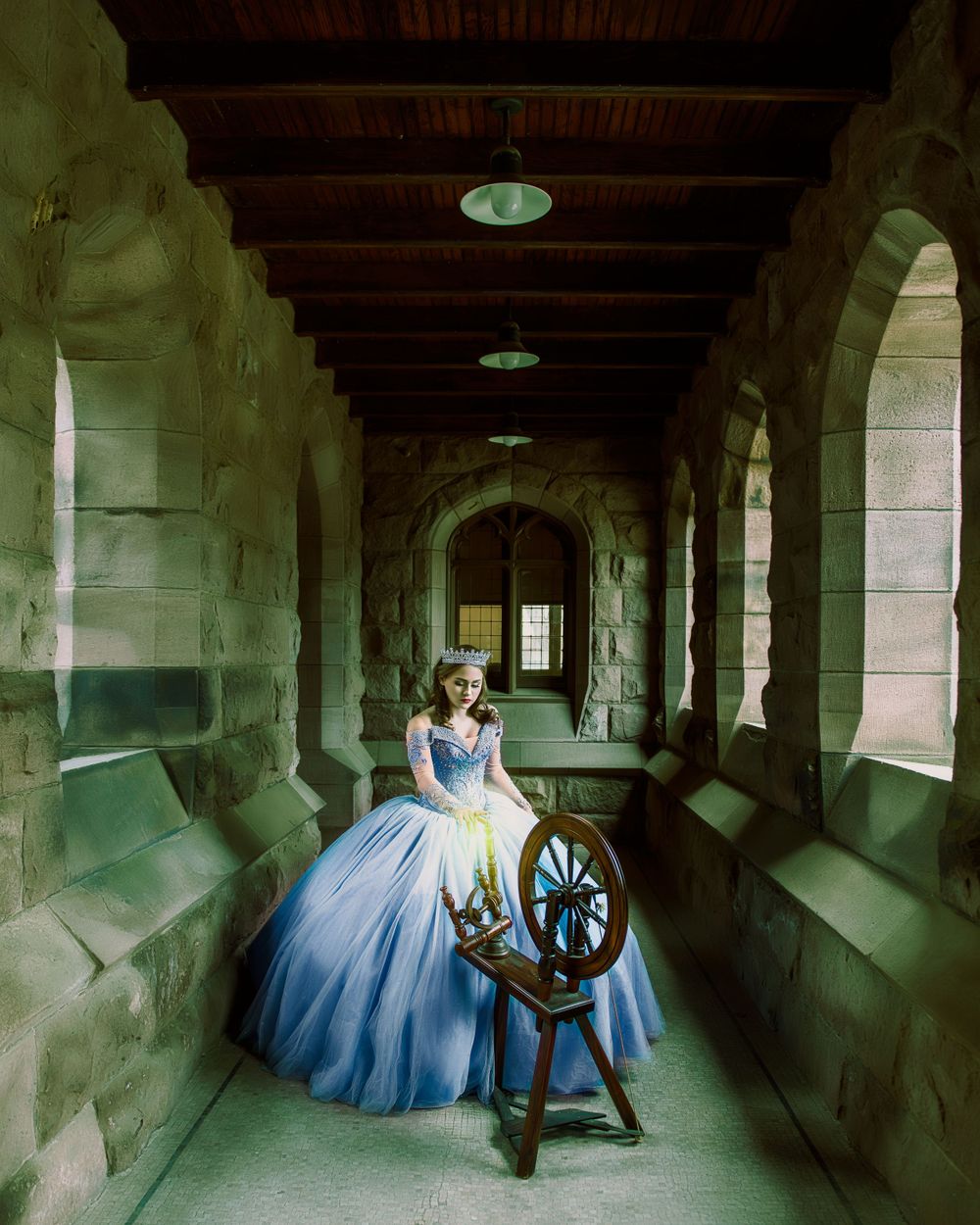 Sleeping Beauty Quinceanera Sweet 16 theme princess aurora in a castle pricking her finger on a spinning wheel, photo session