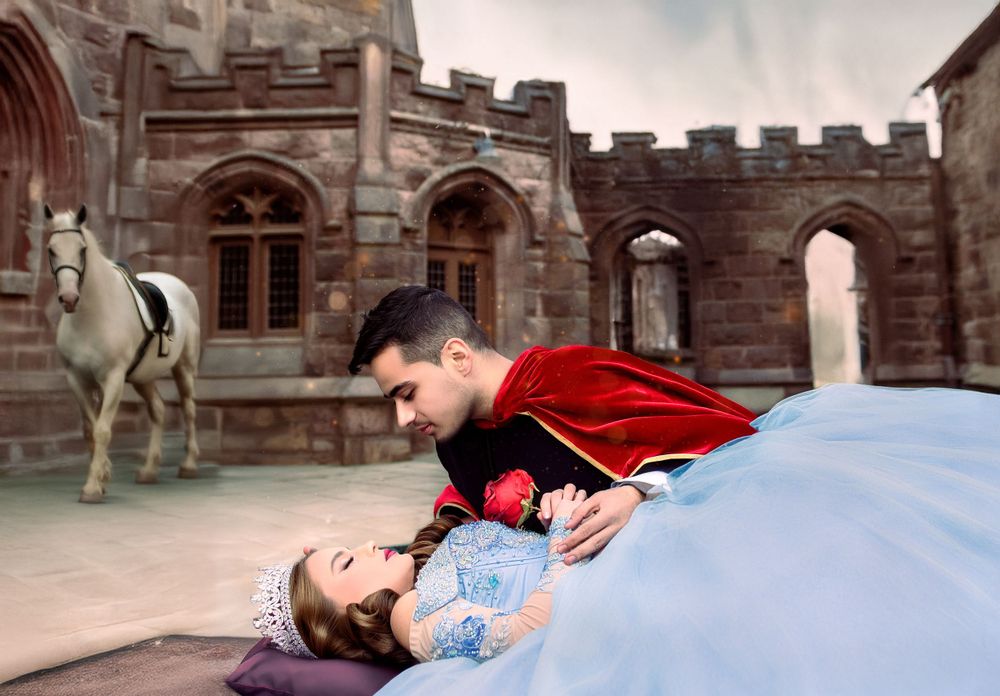 Sleeping Beauty Quinceanera Sweet 16 theme prince Phillip leaning over princess aurora to wake her up with love's first kiss, photo session