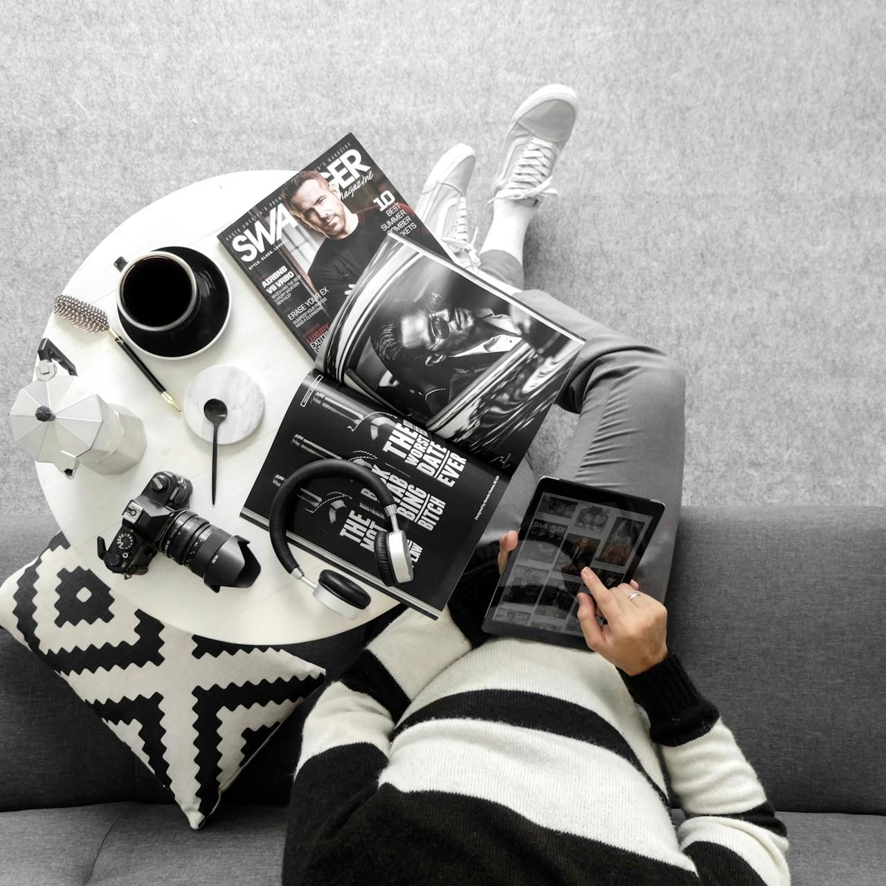 Photo of a person reading a magazine.