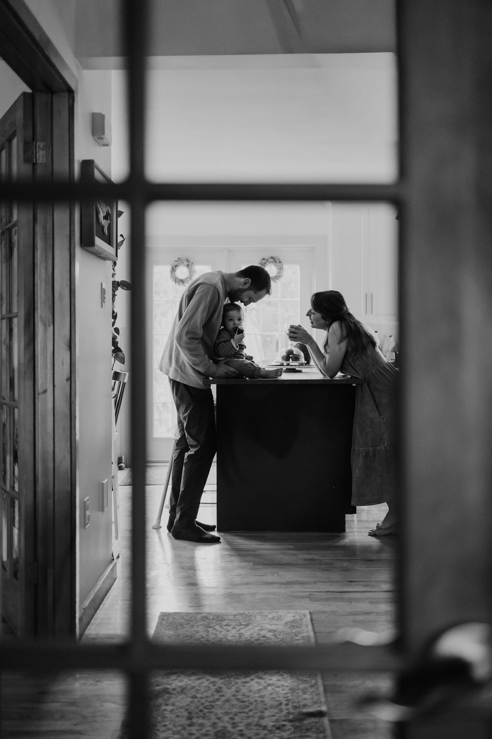 A series of black and white photos showing silhouettes of people in an office hallway and workspace.