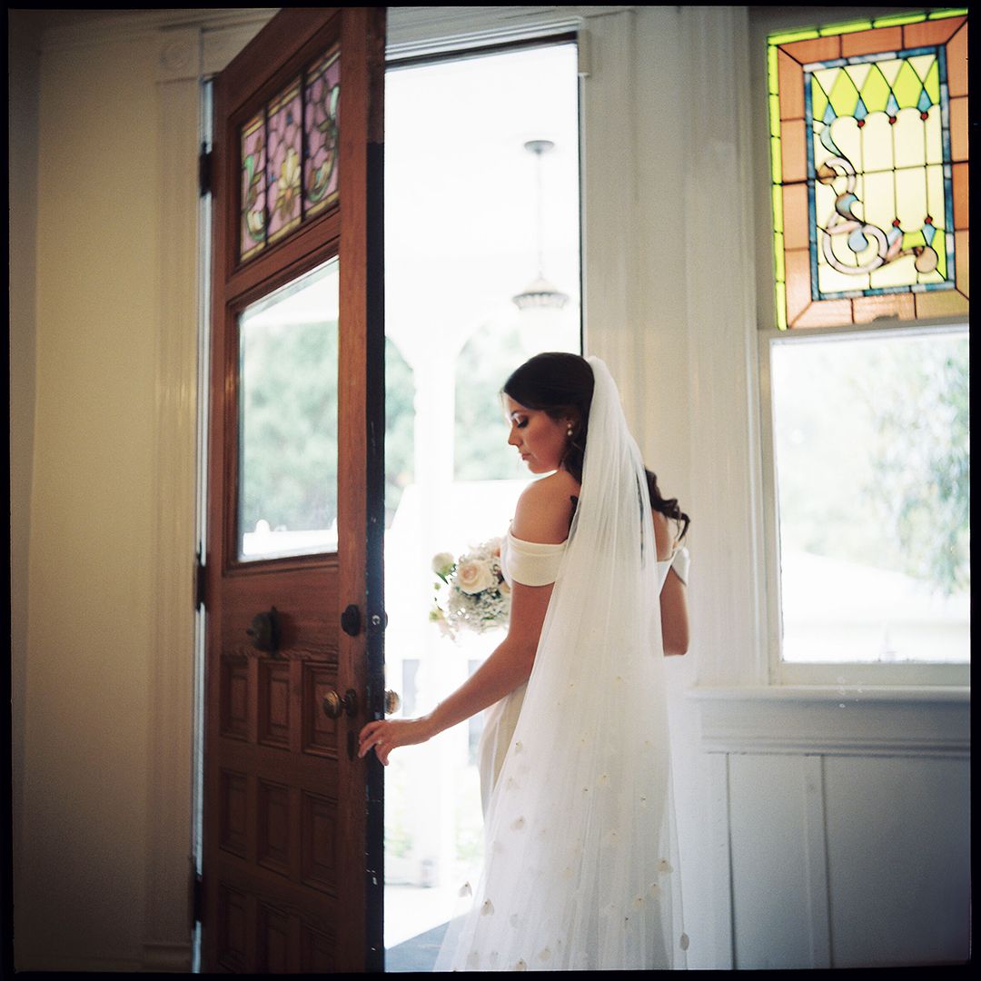 Sequence of photos showing someone entering through a doorway with stained glass windows.