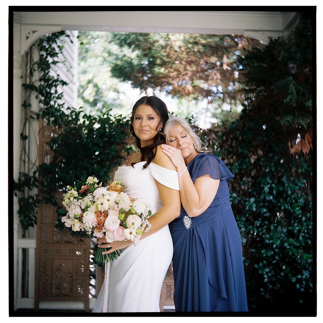 Wedding day moment captured with soft lighting and floral bouquet.