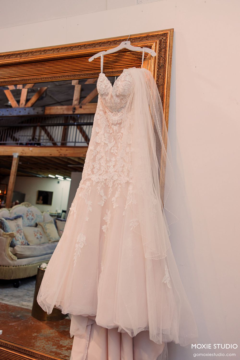 Elegant white wedding dress with lace details and tulle skirt displayed in multiple angles against neutral backgrounds.