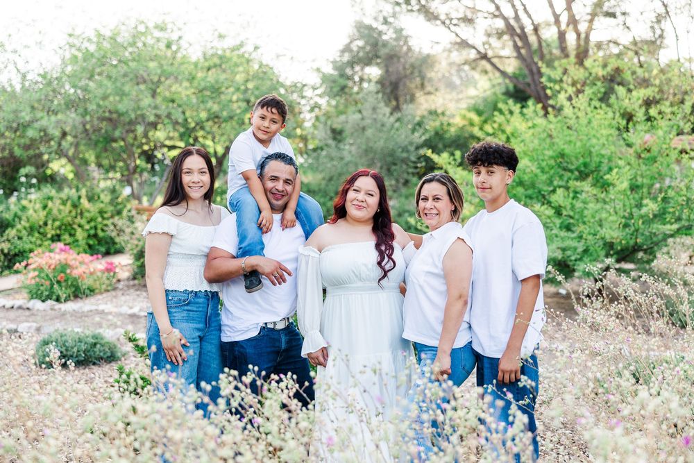 Royal High School senior posing at Conejo Valley Botanical Gardens in Ventura County, capturing natural light and joyful outdoor portraits.