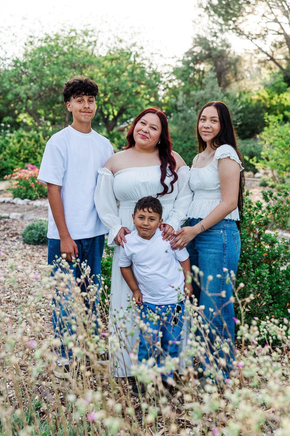Royal High School senior posing at Conejo Valley Botanical Gardens in Ventura County, capturing natural light and joyful outdoor portraits.