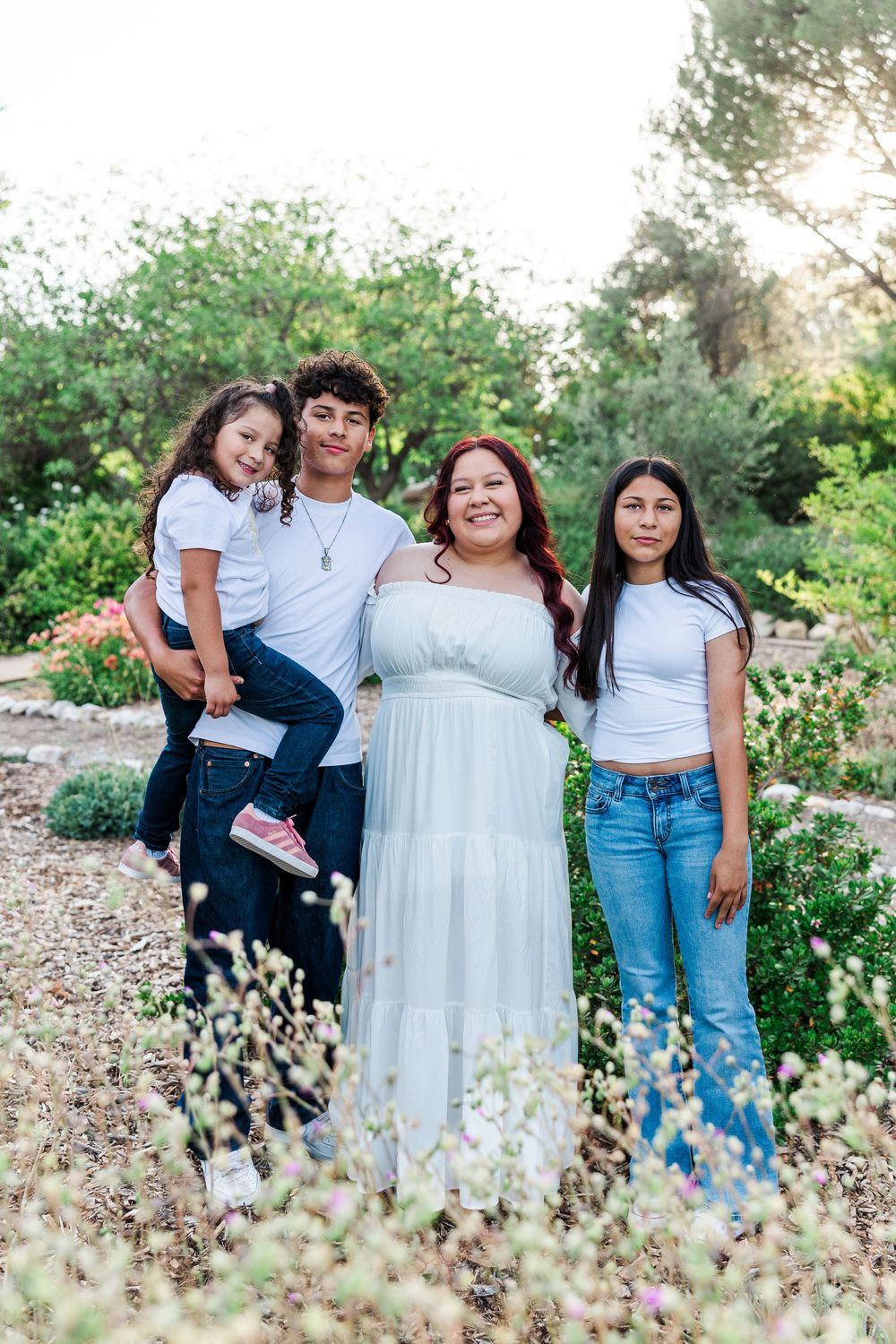 Royal High School senior posing at Conejo Valley Botanical Gardens in Ventura County, capturing natural light and joyful outdoor portraits.