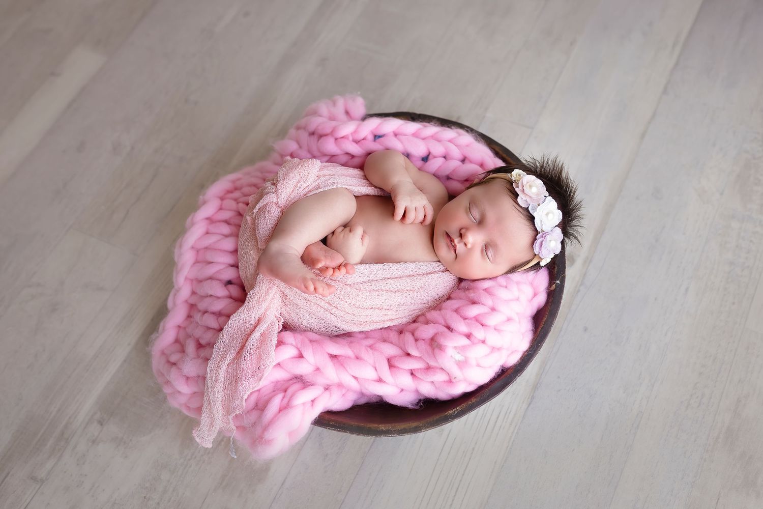 Newborn baby girl in pink