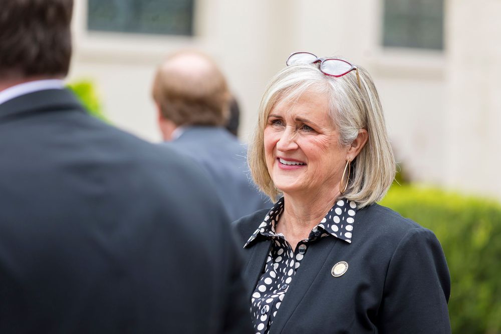 Chief Justice Sarah Hicks Stewart socializing during an outdoor networking opportunity.