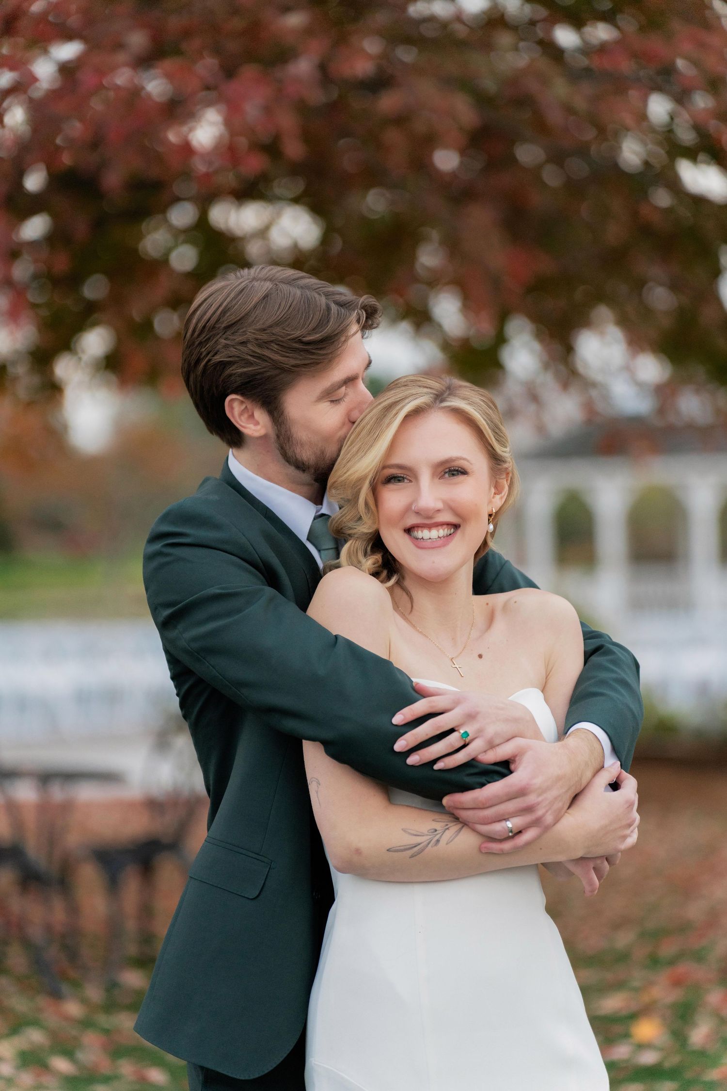 Autumn wedding photos showing tender embraces among fallen leaves.