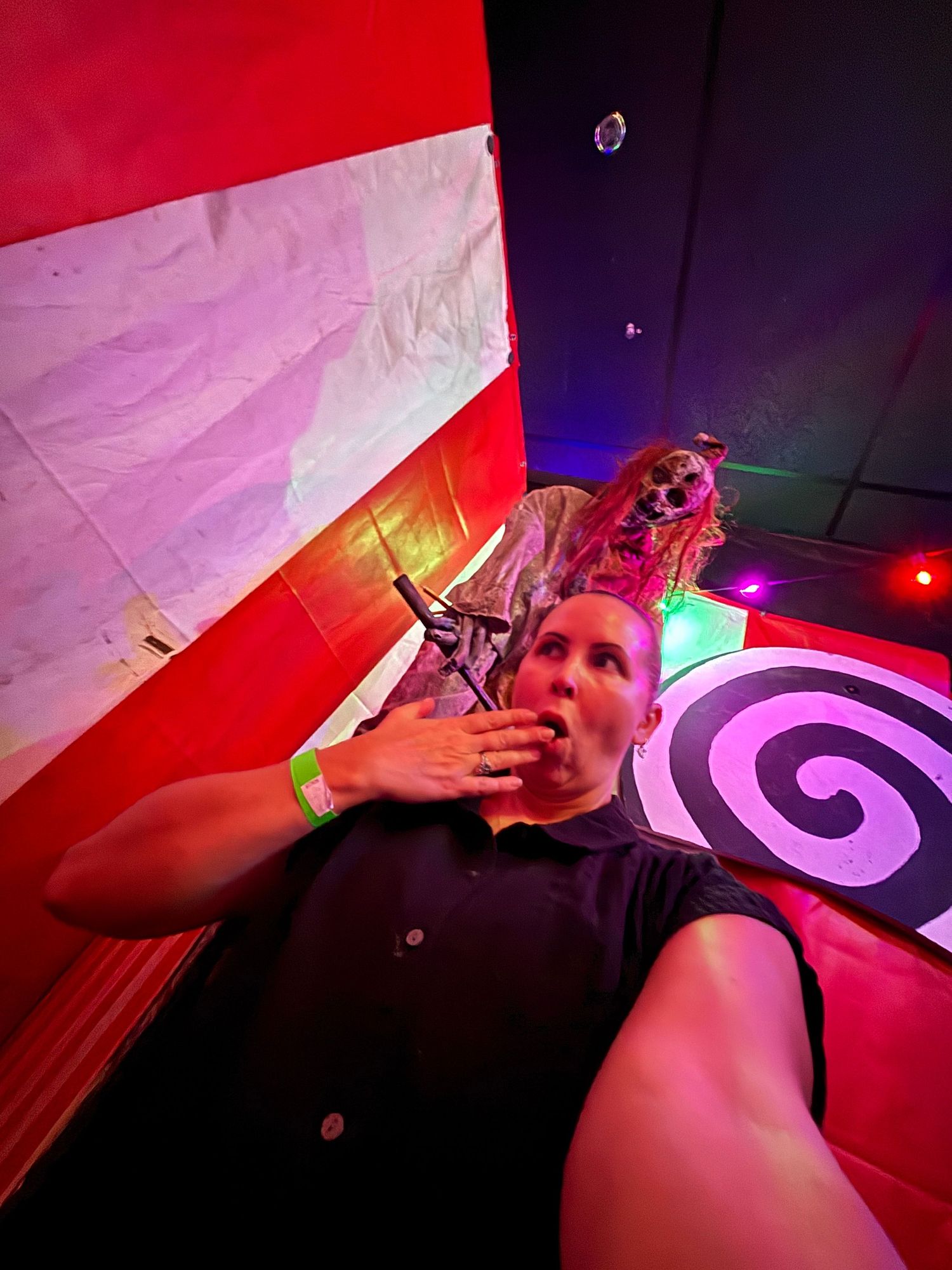 Artistic photo series with vibrant red and purple lighting effects in a nightclub setting.