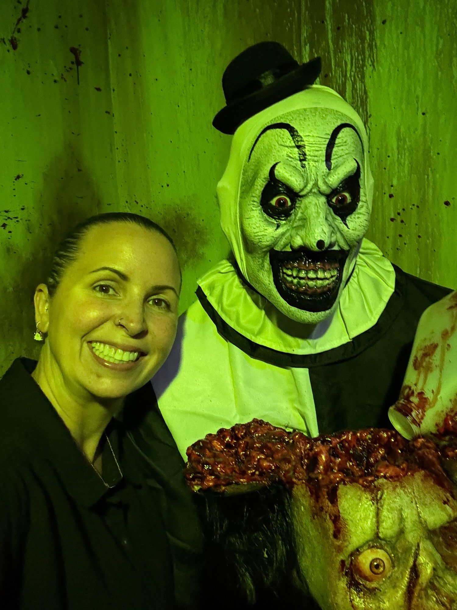 Spooky green-tinted horror themed photos featuring creepy clown masks and theatrical lighting effects.