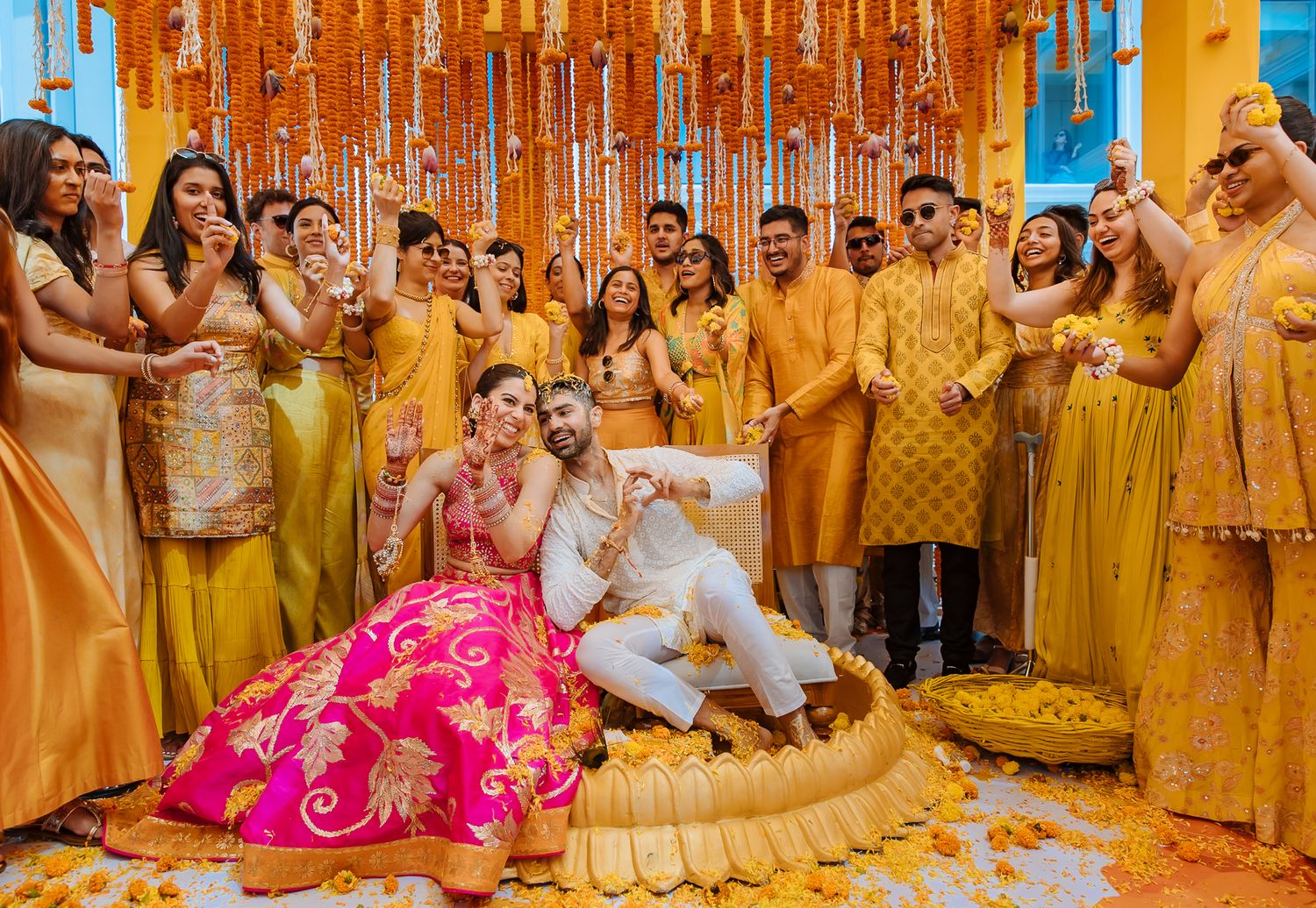 Family and friends celebrating and blessing the couple during the Haldi at Tivoli Chattarpur