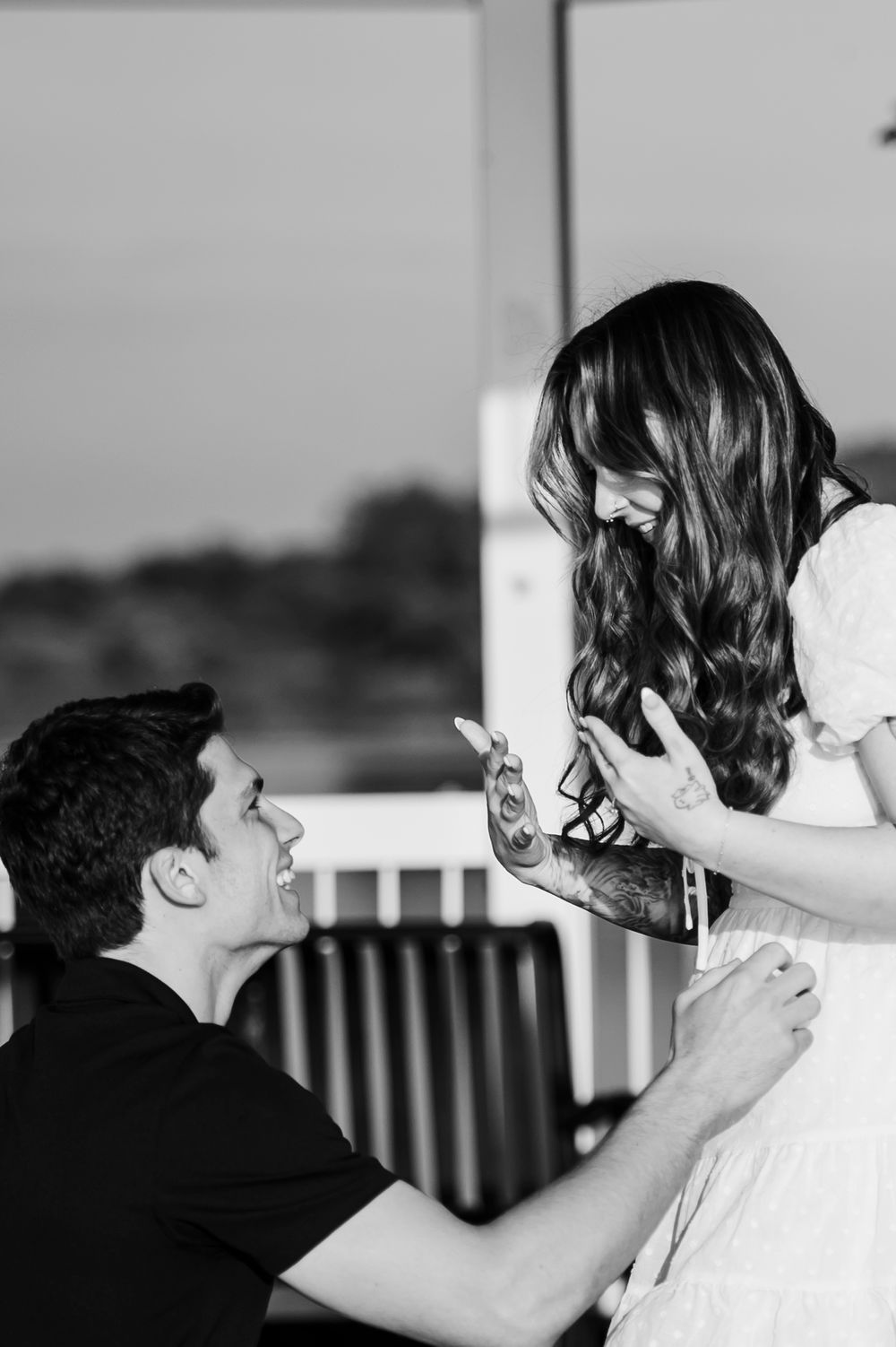 A black and white photo sequence shows a romantic first kiss moment between a couple at their wedding ceremony.