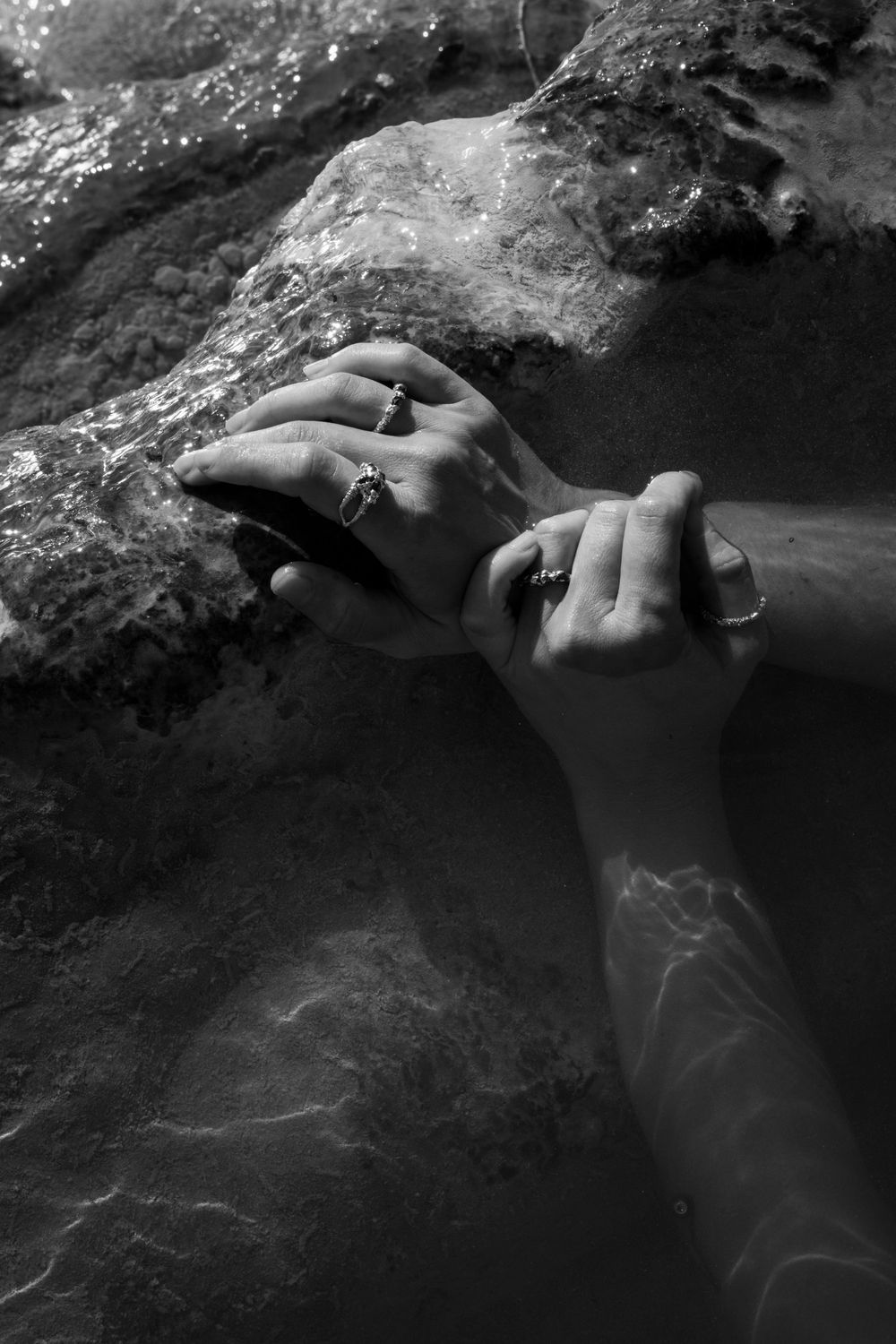 B&W detail shot of a jeweler’s hands polishing a ring; process-driven brand storytelling for ethical and handmade jewelry lines.
