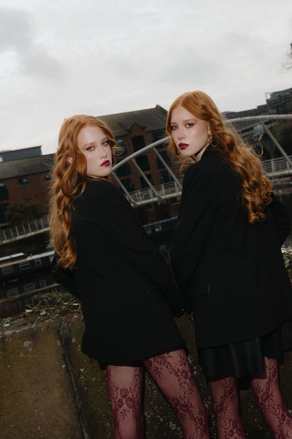 Fashion photo sequence showing a model in black coat and patterned tights against an industrial backdrop.