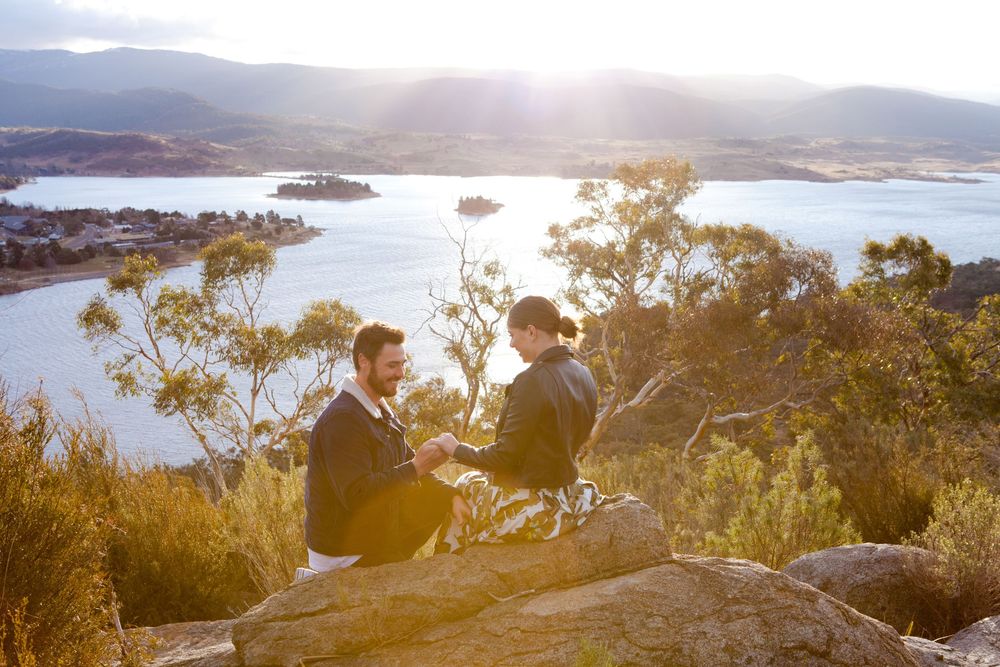 Panoramic coastal landscape views with mountains and water during golden hour.