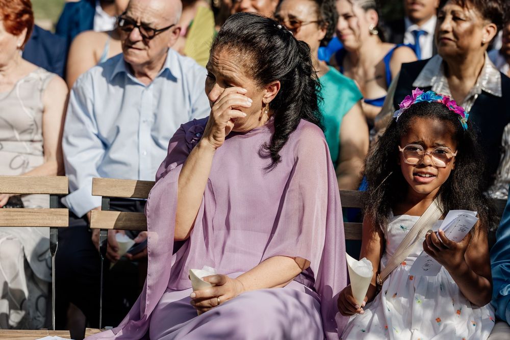 Diverse audience members react with laughter and smiles while watching an entertaining performance or presentation.