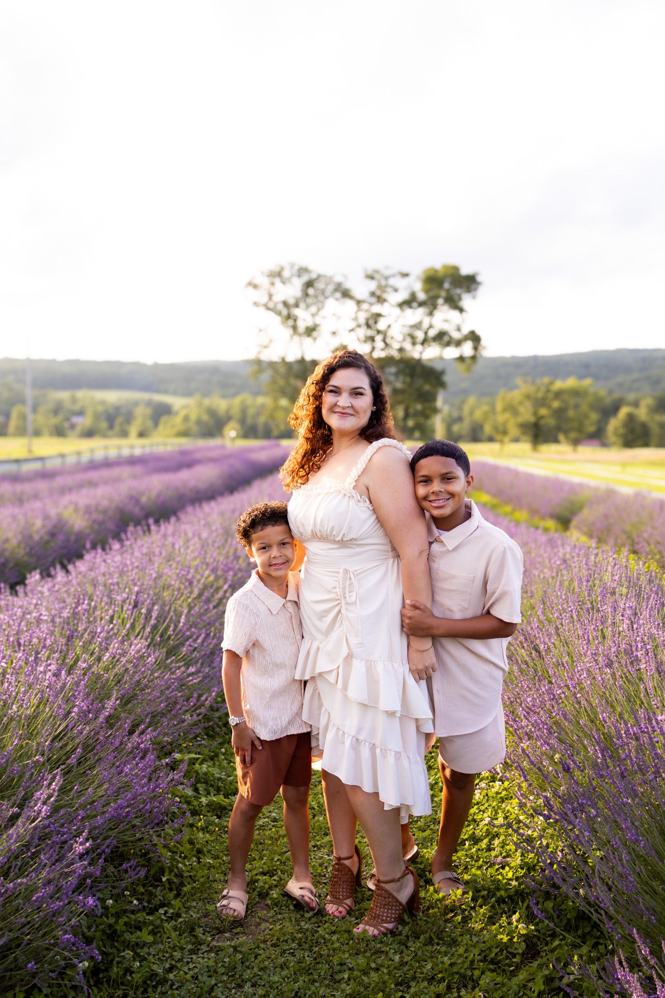 family smiling in field of lavender