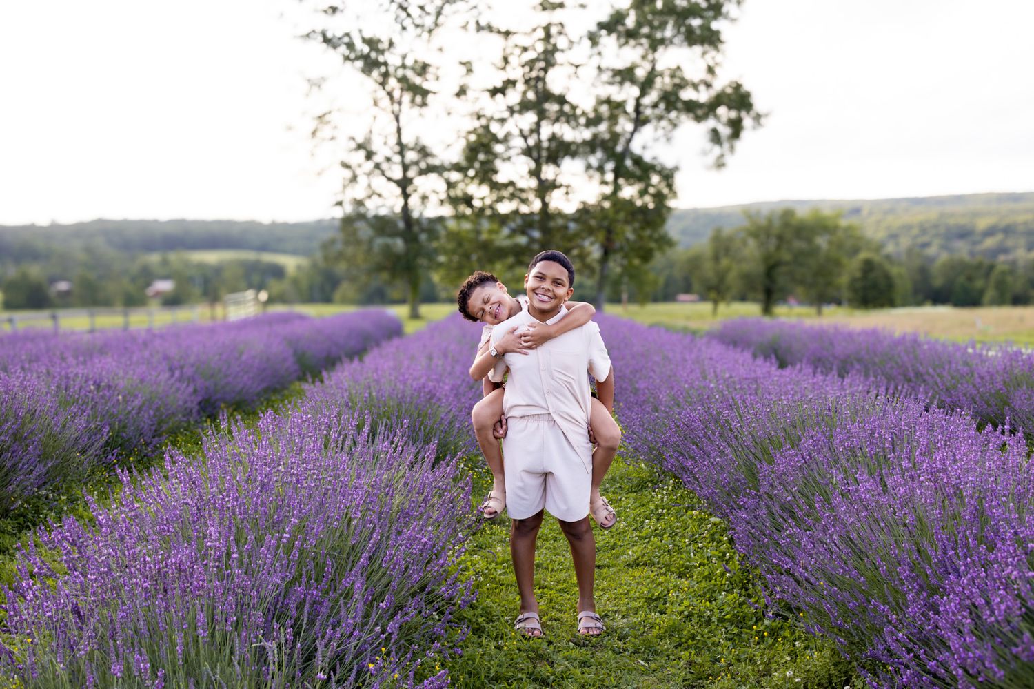 two brothers smiling in lavender field