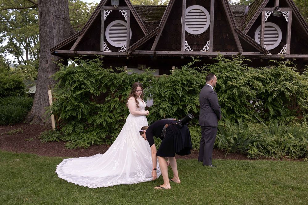 A bride and groom share an intimate moment during their outdoor garden wedding ceremony.