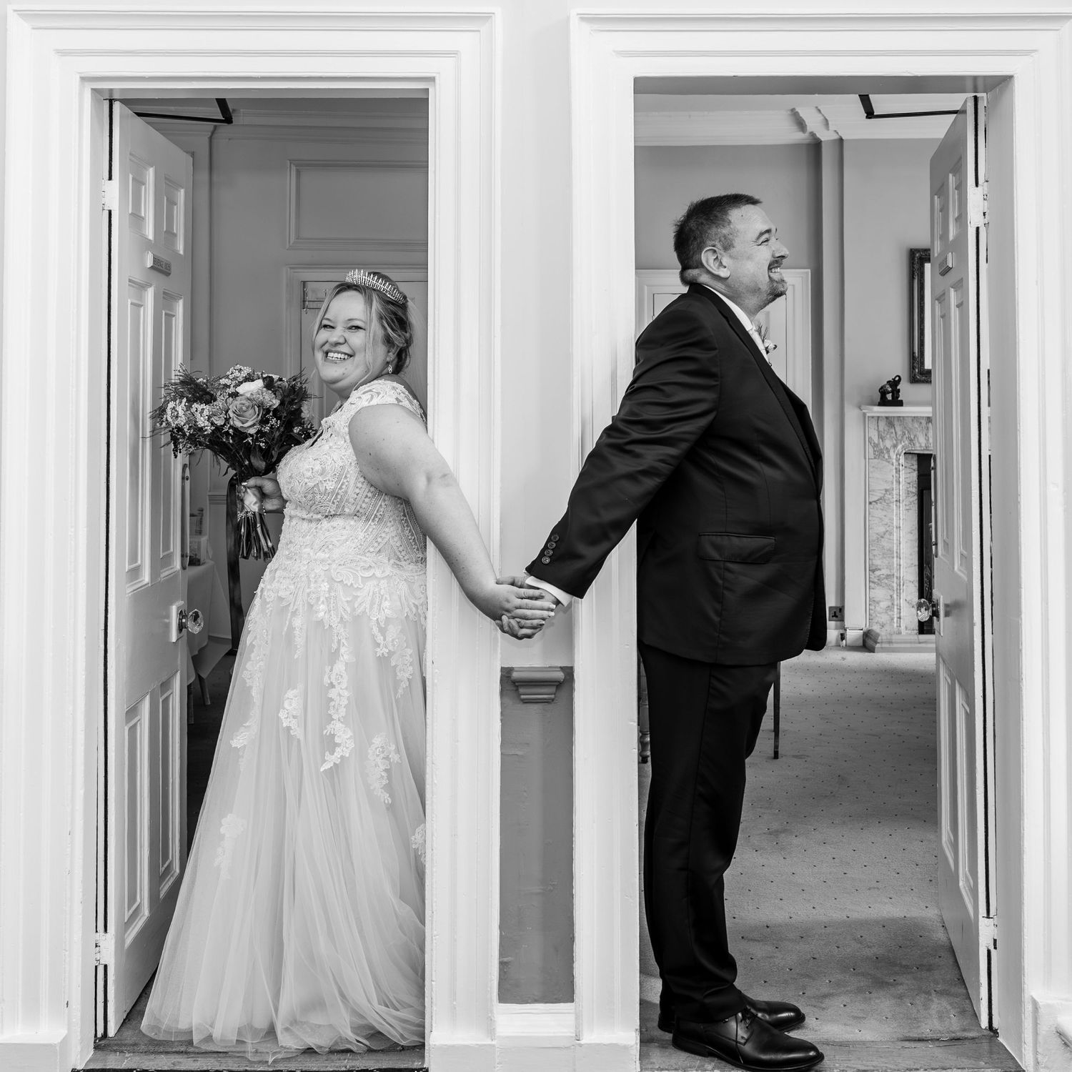 A collection of black and white wedding photos showing dress details, shoes, and candid moments in a hallway.