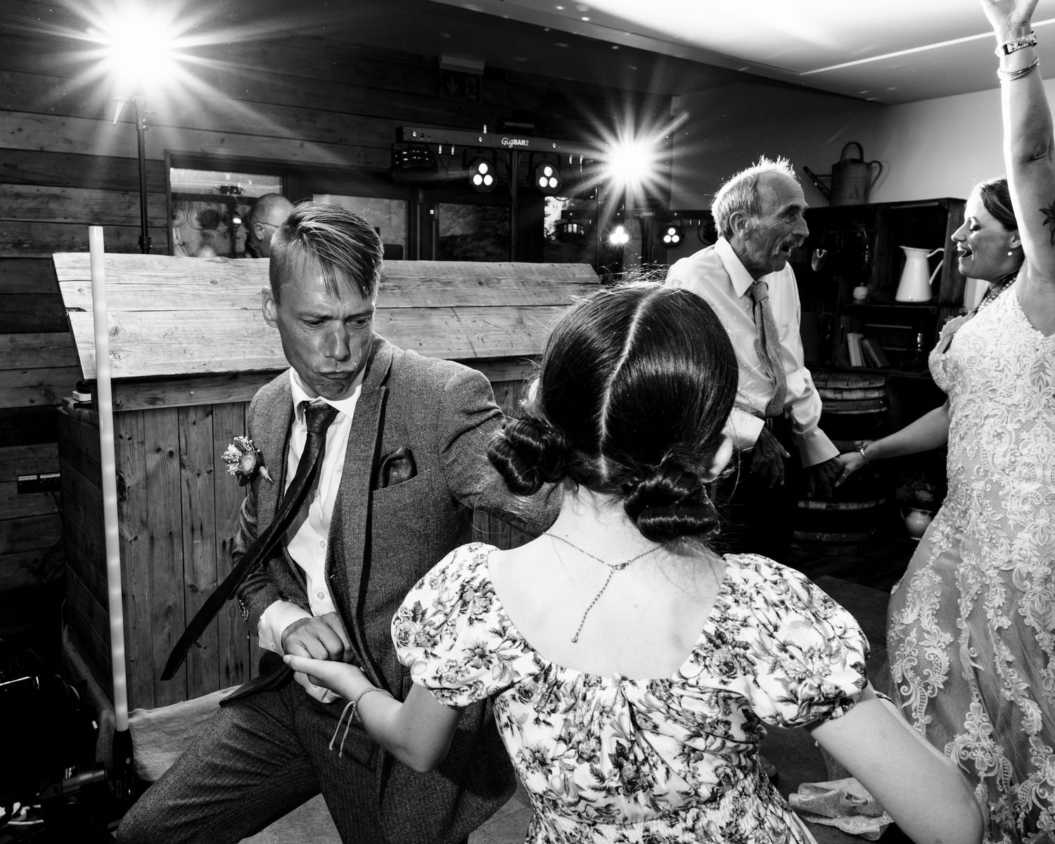 A series of black and white photographs showing couples dancing together at what appears to be a social gathering.