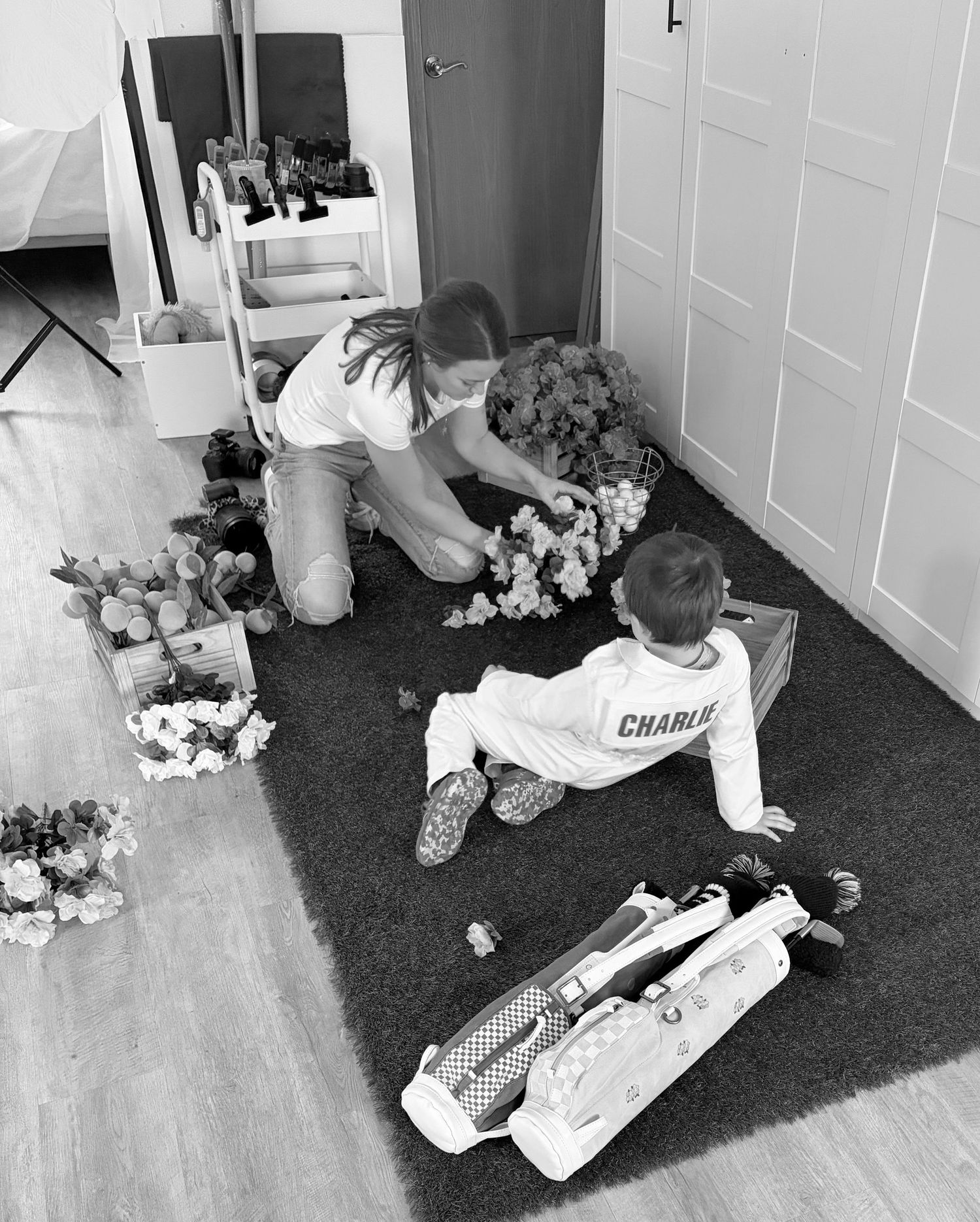 A sequence of black and white images showing someone lying on the floor next to scattered papers and documents.