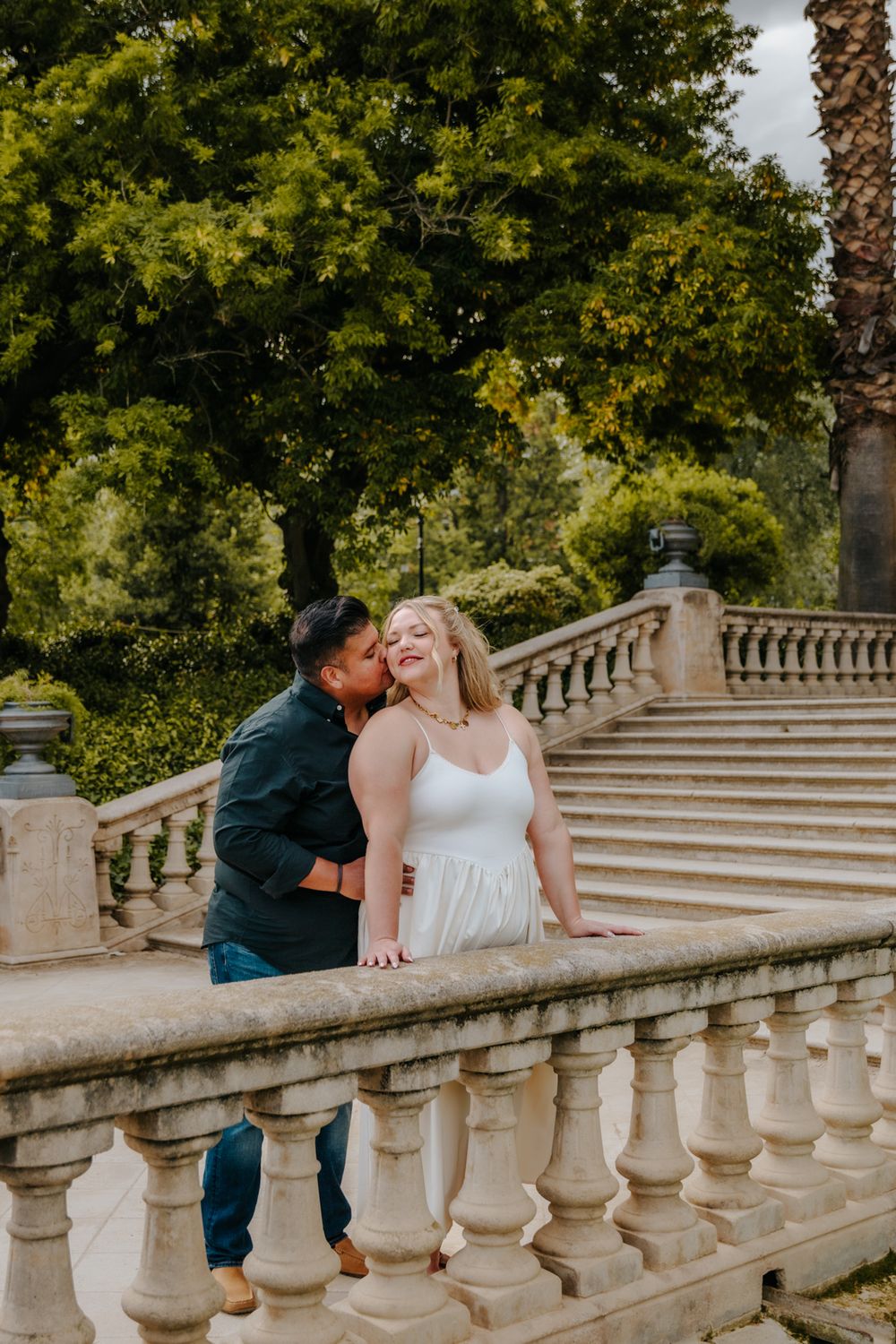 Sweet embrace captured in Ciutadella Park after saying yes.
