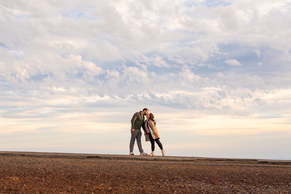 Maui couple engagement photographer photo against beautiful Maui sunset Haleakala summit by ohwowfotos.