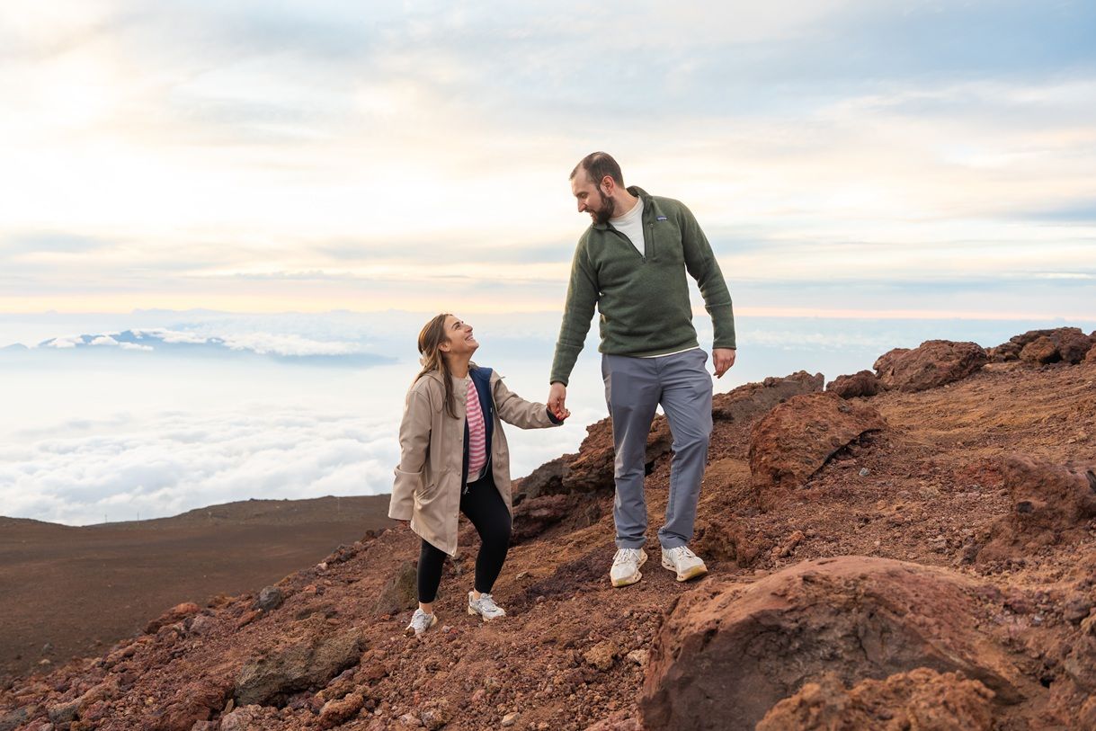 Maui couple engagement photographer photo against beautiful Maui sunset Haleakala summit by ohwowfotos.