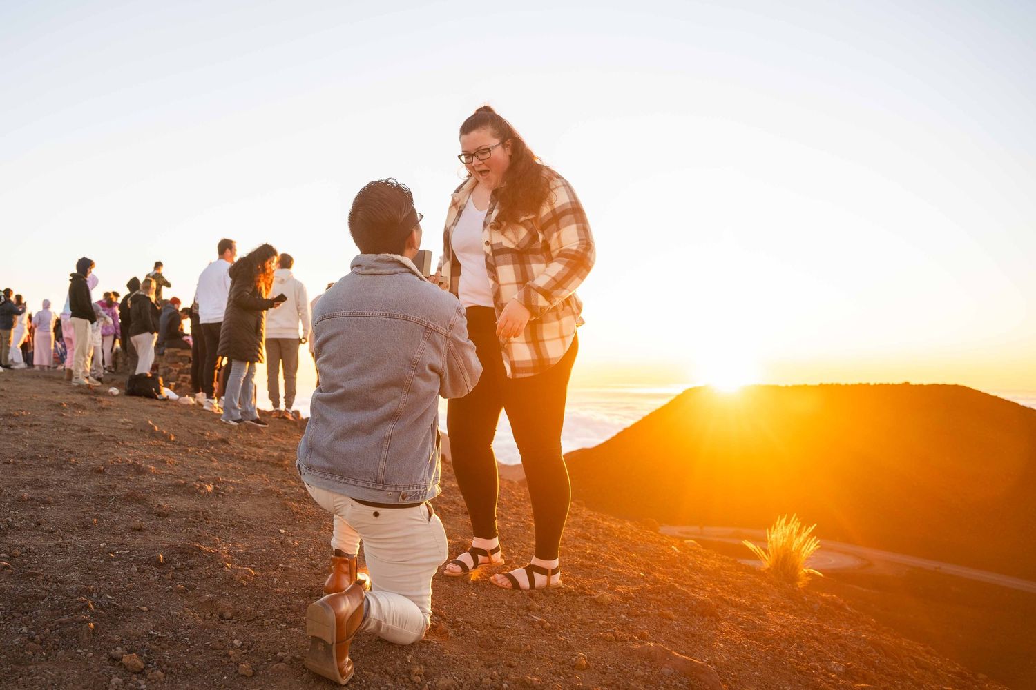 Maui couple engagement photographer photo against beautiful Maui sunrise Haleakala summit by ohwowfotos.