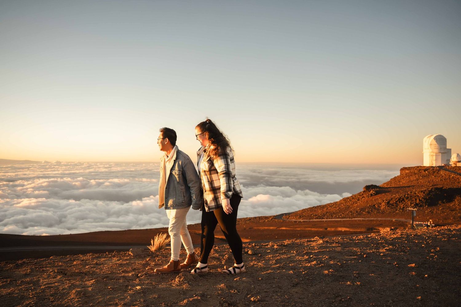 Maui couple engagement photographer photo against beautiful Maui sunrise Haleakala summit by ohwowfotos.