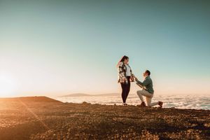 Maui couple engagement photographer photo against beautiful Maui sunrise Haleakala summit by ohwowfotos.