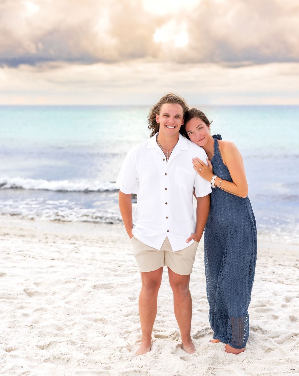 A series of beach photos showing two people in casual attire posing along the shoreline at sunset.