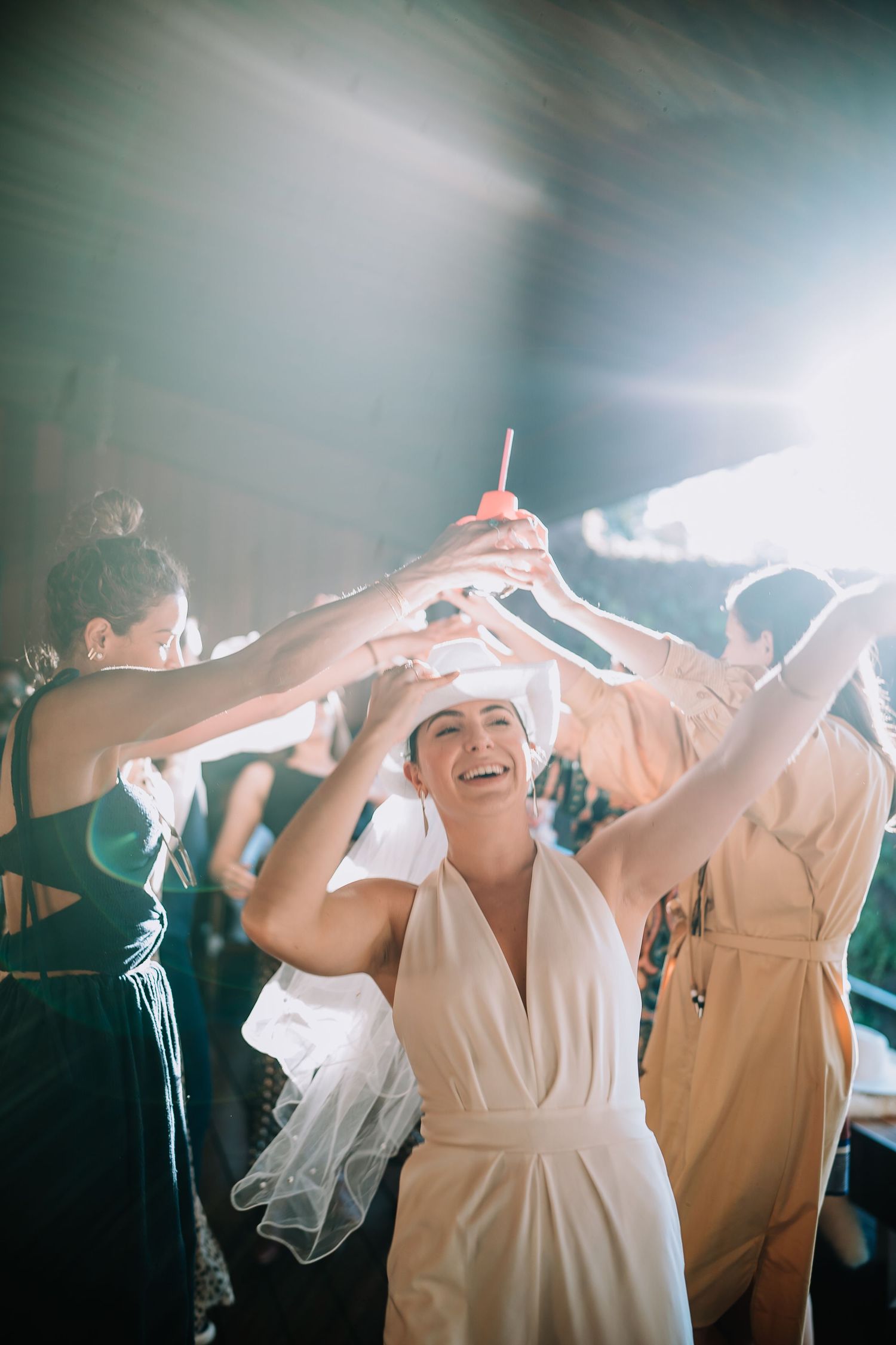 Celebration scene with guests dancing and enjoying festive atmosphere.