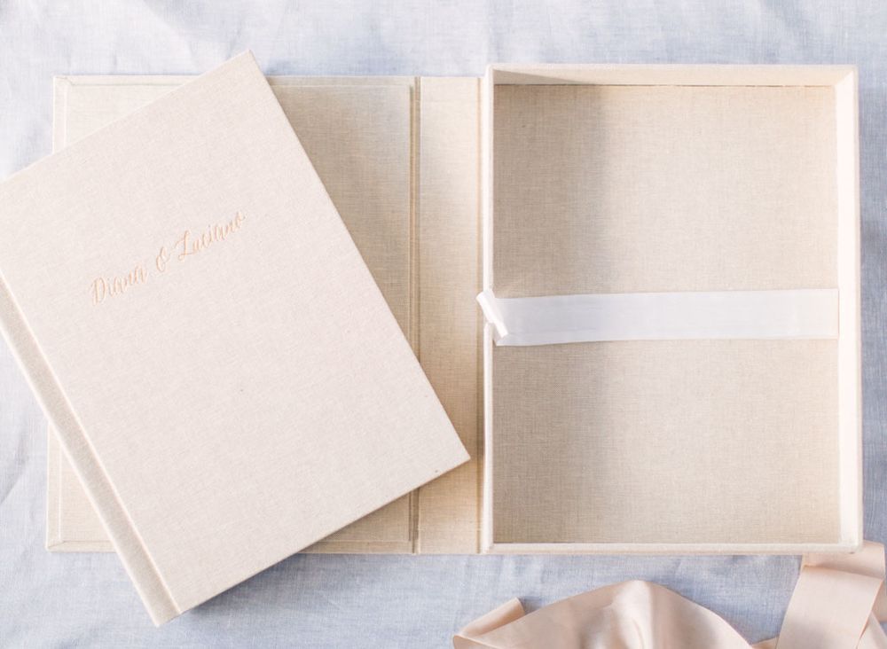 Several white gift boxes arranged on a light background showcasing elegant product packaging.
